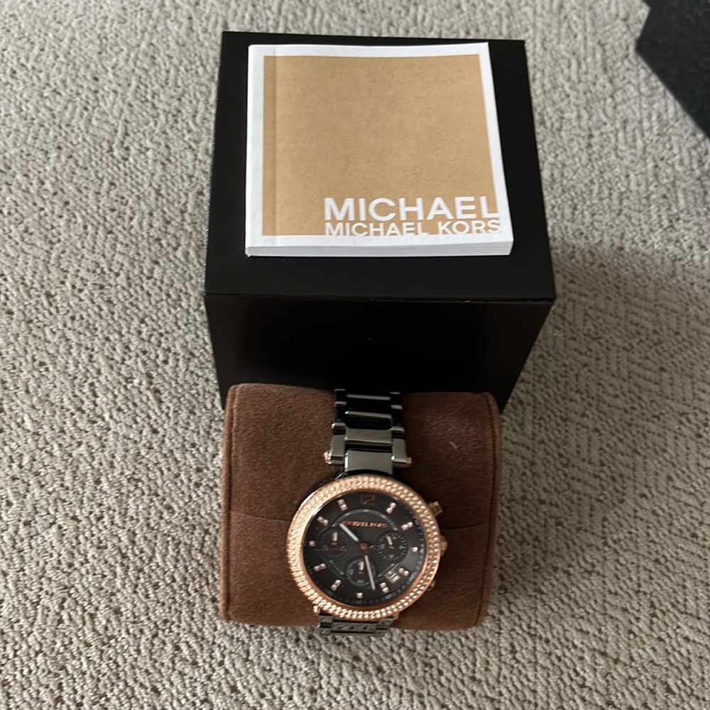 Michael Kors black nickel and rose gold watch.